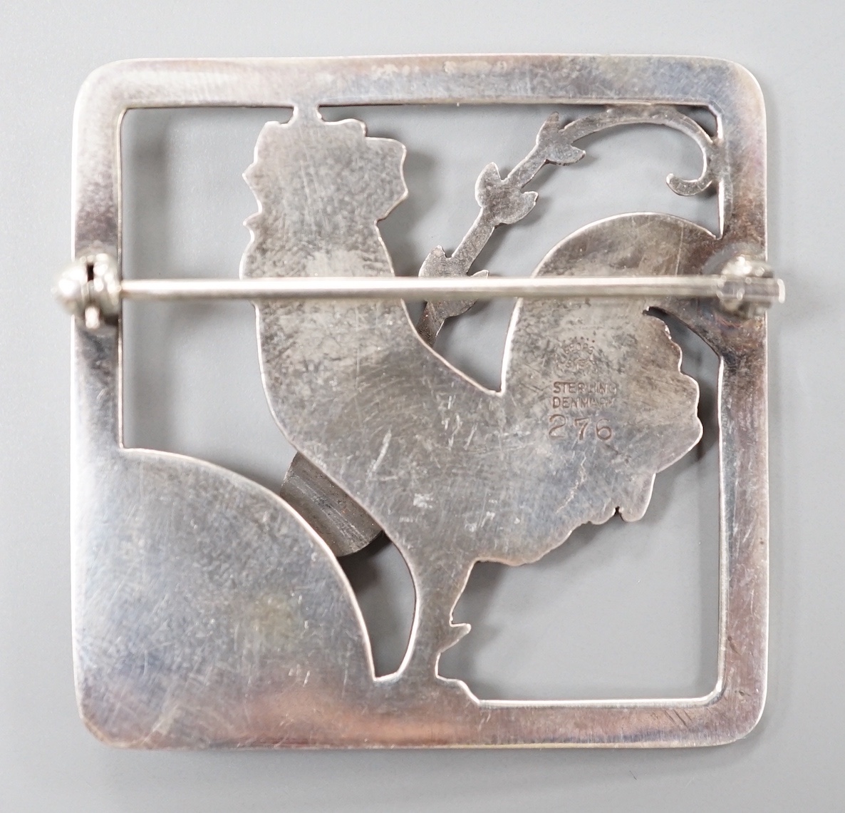 A Georg Jensen sterling 'cockerel and frond' square brooch, no. 276, 37mm.